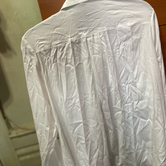 A satin blouse. - Picture 2 of 8